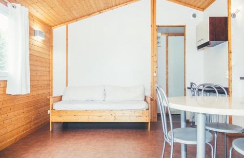 Beynat Ski Chalet | Idyllic Wooden Chalet by the Lake with Covered Terrace