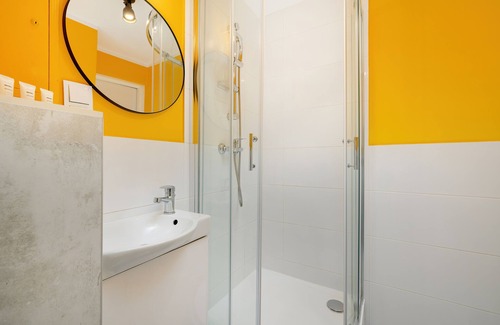 Brynow Apartment | Bright Yellow and Grey Studio with Breakfast & Kitchen Access