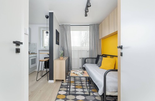 Brynow Apartment | Bright Yellow and Grey Studio with Breakfast & Kitchen Access