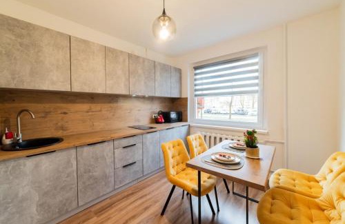 Siauliai Apartment | Inviting Yellow Apartment - Child Friendly & Rated 9.5/10