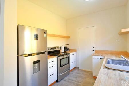 La Paz Apartment | Idyllic Yellow Home Near Coromuel Beach - Perfect for Families