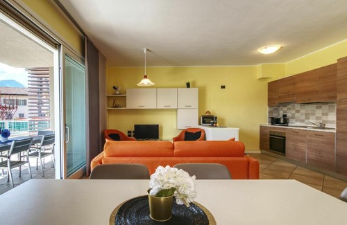 Gera Lario Apartment | Inviting Yellow Lake View: Poolside Escape for Families