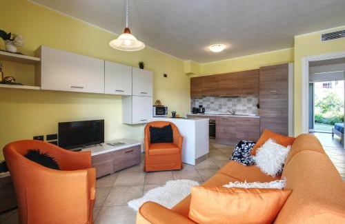 Gera Lario Apartment | Inviting Yellow Lake View: Poolside Escape for Families
