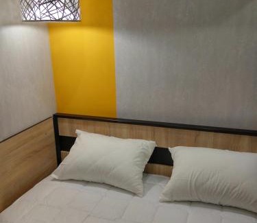 Sukhinovka Apartment | Yellow Loft: 2-Bedroom Getaway with Breakfast Included