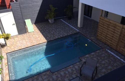 Saint-Andre Apartment | Relax at Ylang Résidence with Heated Pool and Hot Tub