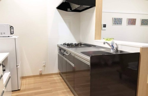 Tomigusuku Apartment | Modern YN12 Condominium Near Airport with Family Amenities