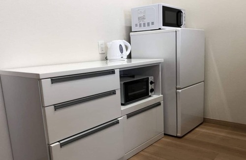 Tomigusuku Apartment | Modern YN14 Condominium near Airport with Family Amenities