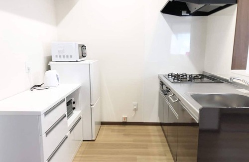 Tomigusuku Apartment | Relaxing YN32 Condominium Near Airport with Family Amenities