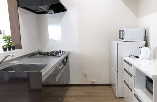 Tomigusuku Apartment | Modern YN33 Condominium Near Airport with Family Amenities