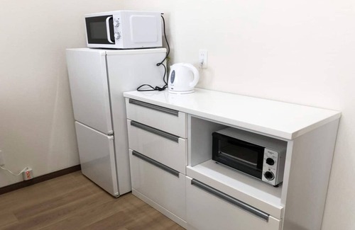 Tomigusuku Apartment | Modern YN33 Condominium Near Airport with Family Amenities