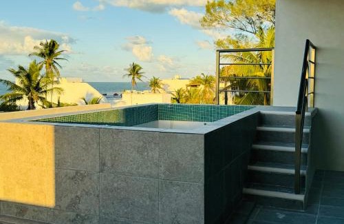 Chuburna Puerto Apartment | Inviting Yokoso Ocean View Beach Property with Pool & Restaurant