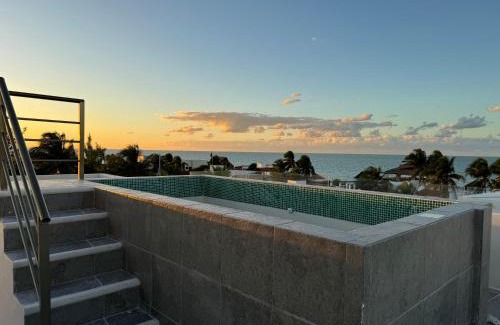 Chuburna Puerto Apartment | Inviting Yokoso Ocean View Beach Property with Pool & Restaurant