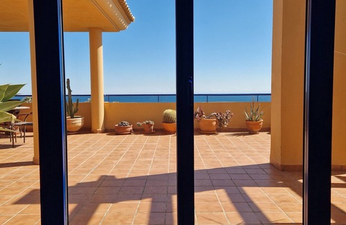 Manilva Apartment | Lovely Vacation Home with South-Facing Terrace & Ocean View