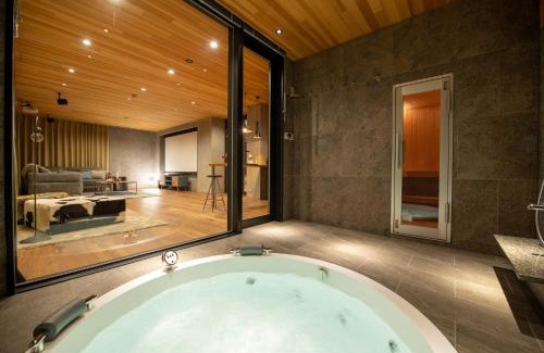 Hirafu Apartment | Discover Zai-On: Family-Friendly Getaway with Hot Tub
