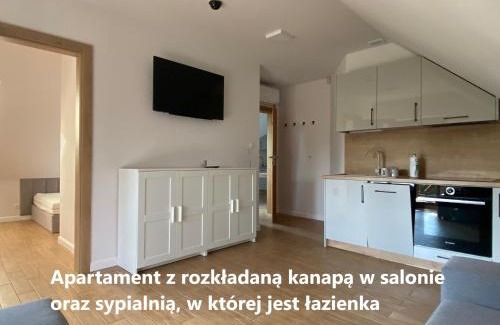 Nowe Guty Apartment | Guest Rated: Zakątek Śniardwy with Hot Tub and Kitchen