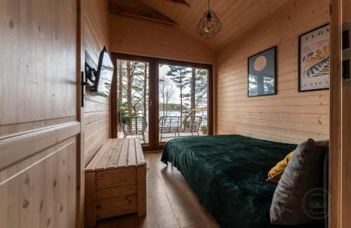 gmina Karsin House | Idyllic Zakątek Wdzydze: Waterfront Retreat with Views