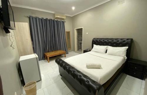 Livingstone Cabin | Discover Zambezi Ultima Lodge: Pool and Breakfast Awaits!