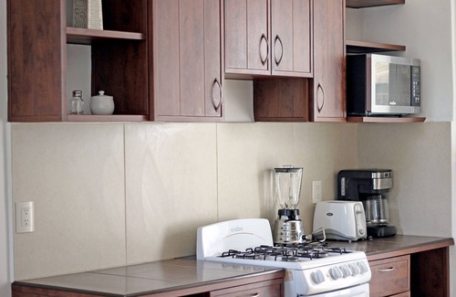 Diaz Ordaz Hotel | Relax at ZenHarmony Suites: Pool, Spa & Family-Friendly