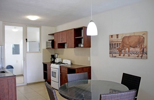 Diaz Ordaz Hotel | Relax at ZenHarmony Suites: Pool, Spa & Family-Friendly