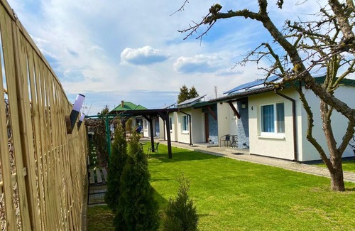Uniejow Ski Chalet | Oceanfront Escape at Zielone Zacisze with Hot Tub & Views