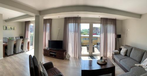 Municipality of Katwijk Apartment | Oceanfront Zilvermeeuw: Family-Friendly with Hot Tub & Views