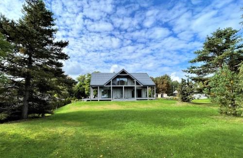 Berzciems Villa | Relax at Zušu Villa - Oceanfront with Exceptional Amenities