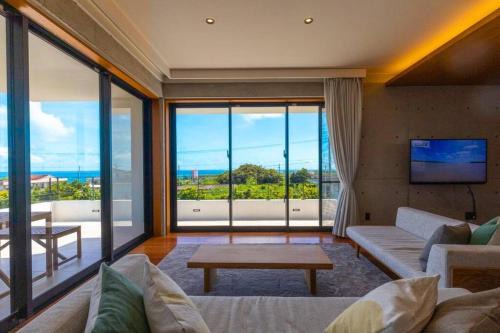 オーシャンビューの新築インテリアデザインを貸切!テラス付きの宿で最高の休日をお楽しみください