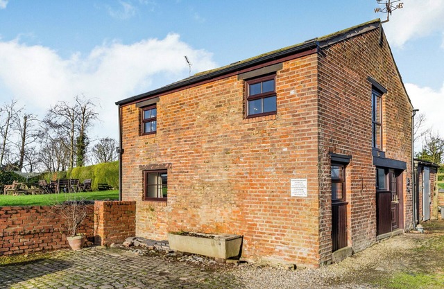 A spacious cottage with a first floor living space boasting far reaching views.