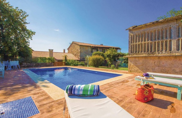 About 20 kilometers from the Ría de Pontevedra, this stone vacation home has been restored to offer