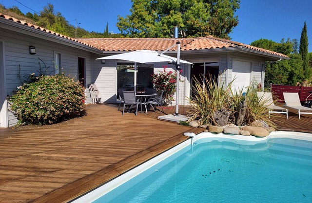 Air-conditioned villa with pool terrace, parking, solar roof and charging station.