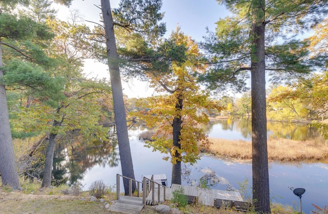 Antiquing & Fishing: Riverfront Waupaca Home!