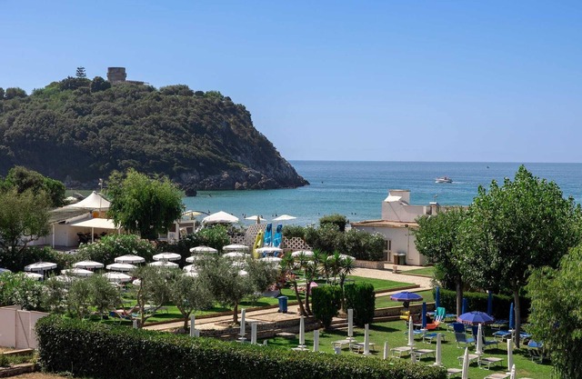 Apartment in portion of villa with solarium and beach.