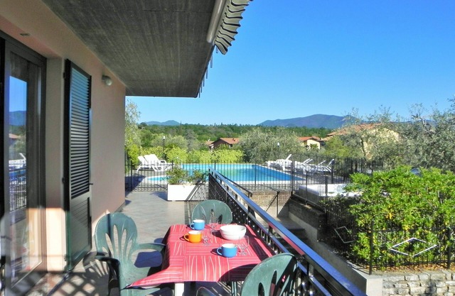 Apartment with swimming pool and soccer field parking lot with gate