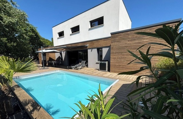 Architect-designed house with heated pool and garden, quiet setting,