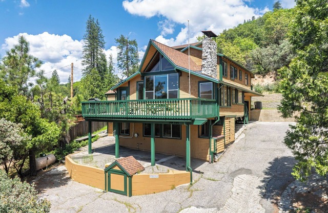 Bass Lake luxury cabin with lake views & boat slip