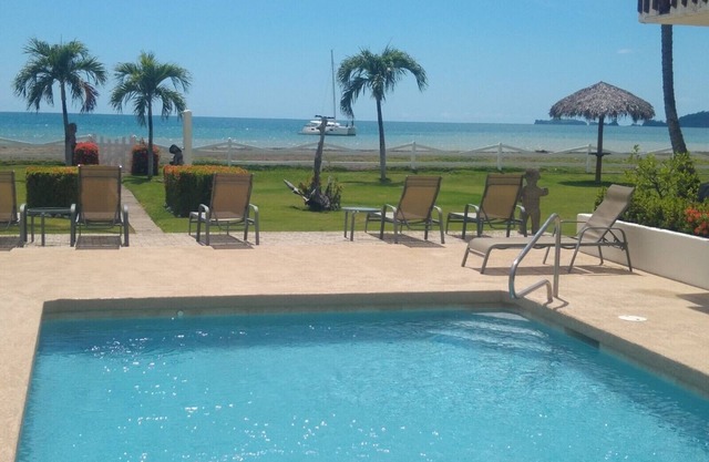 Beachfront one-bedroom, ocean view condo with toes in the sand!