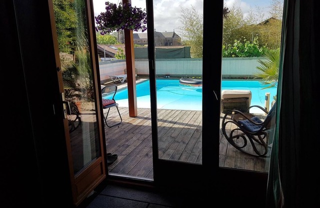 Beautiful wooden house with large swimming pool.