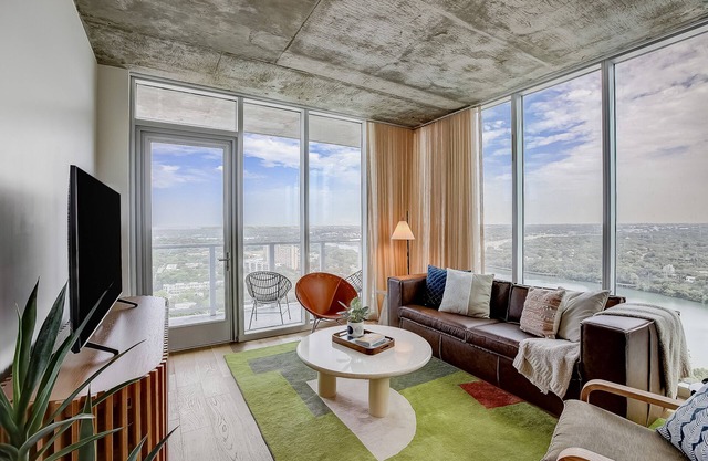 Brand-new skyline-view condo with rooftop pool, balcony, firepit, & fitness room