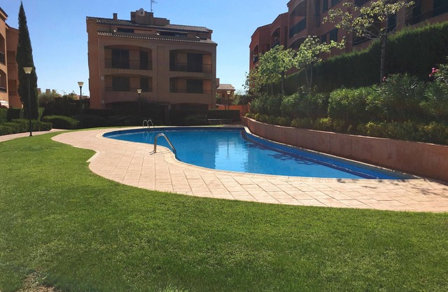 Bright 2BR Apartment with Pool, Near Stunning Cala Beaches, Parking & AC