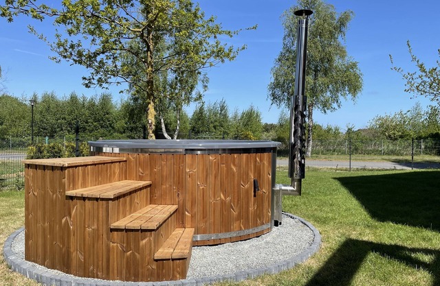 Bright and friendly vacation home with sauna and large garden with whirlpool.