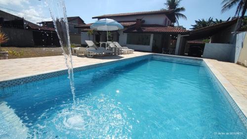 Casa piscina pé na areia Indaiá