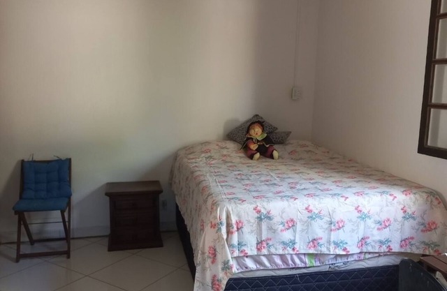 Casinha Cercada de Verde