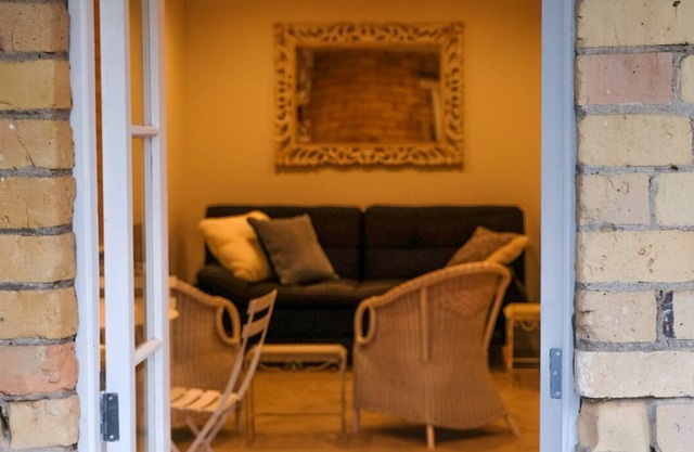 Central Devonport, French country meets heritage in this garden view apartment.