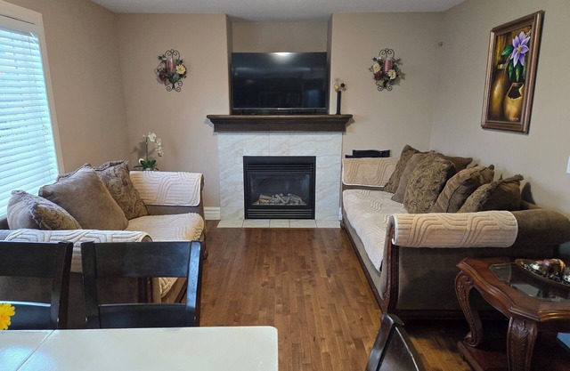 Charming 4-bedroom house with WiFi and fitness room in lovely Airdrie