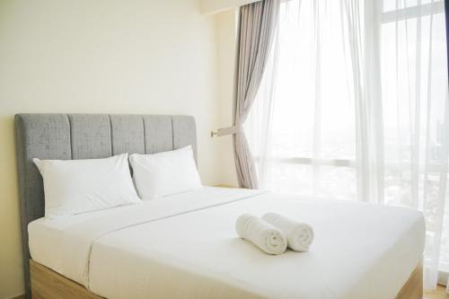 Chic and Cozy 2BR Apartment at Menteng Park By Travelio