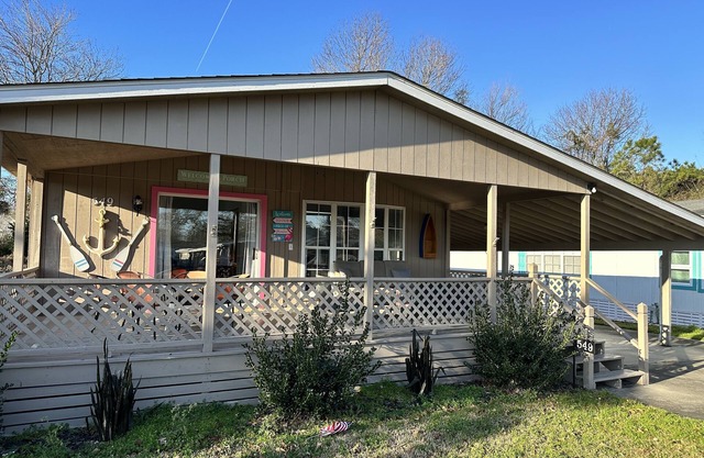 Coastal cottage minutes from the beach. Large front porch for morning sun!