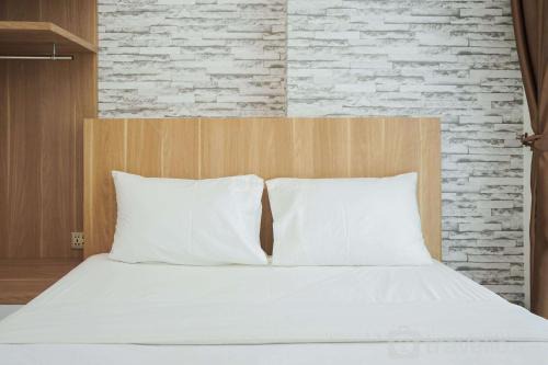 Comfort and Cozy 1BR at Tree Park City BSD Apartment By Travelio