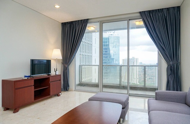 Cozy 2BR at Empyreal Epicentrum Apartment By Travelio