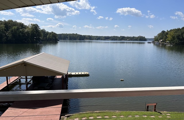 Cozy waterfront home with boat ramp, dock and gentle sloping lot.