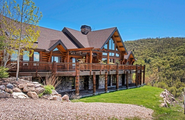 Custom log home nestled in the mountains. Stunning valley views from every room.